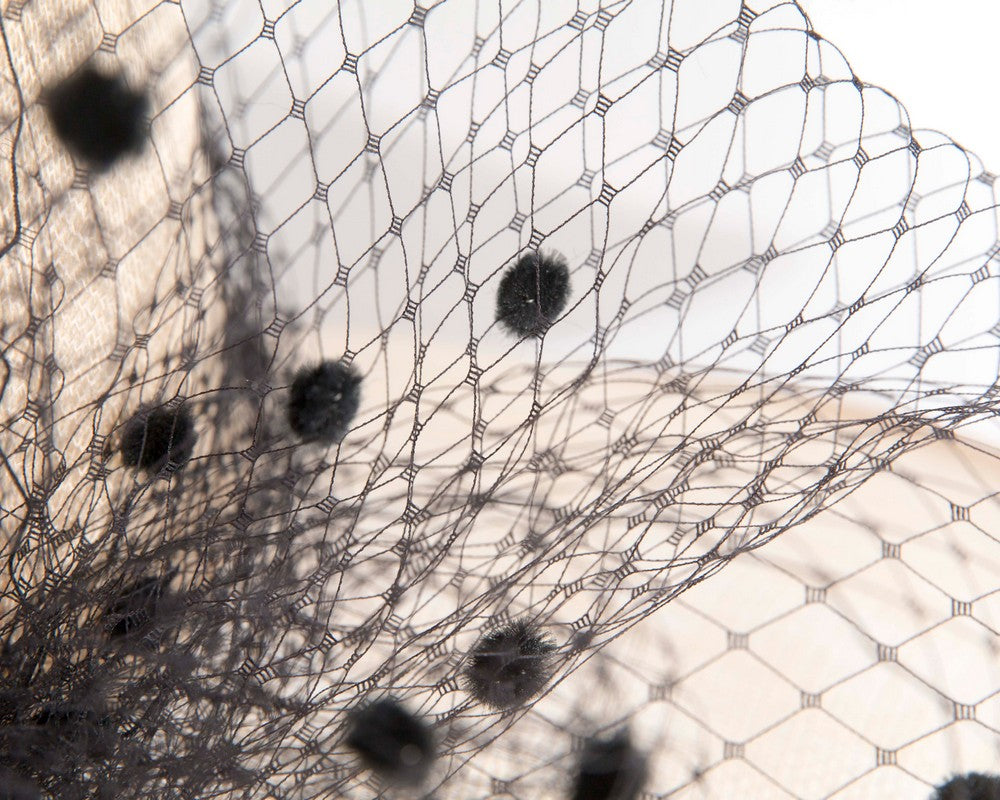 Wide brim cream and black hat